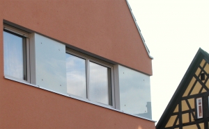 Wohn- und Geschäftshaus - Wärmedämmverbundsystem statt Faserzementplatten